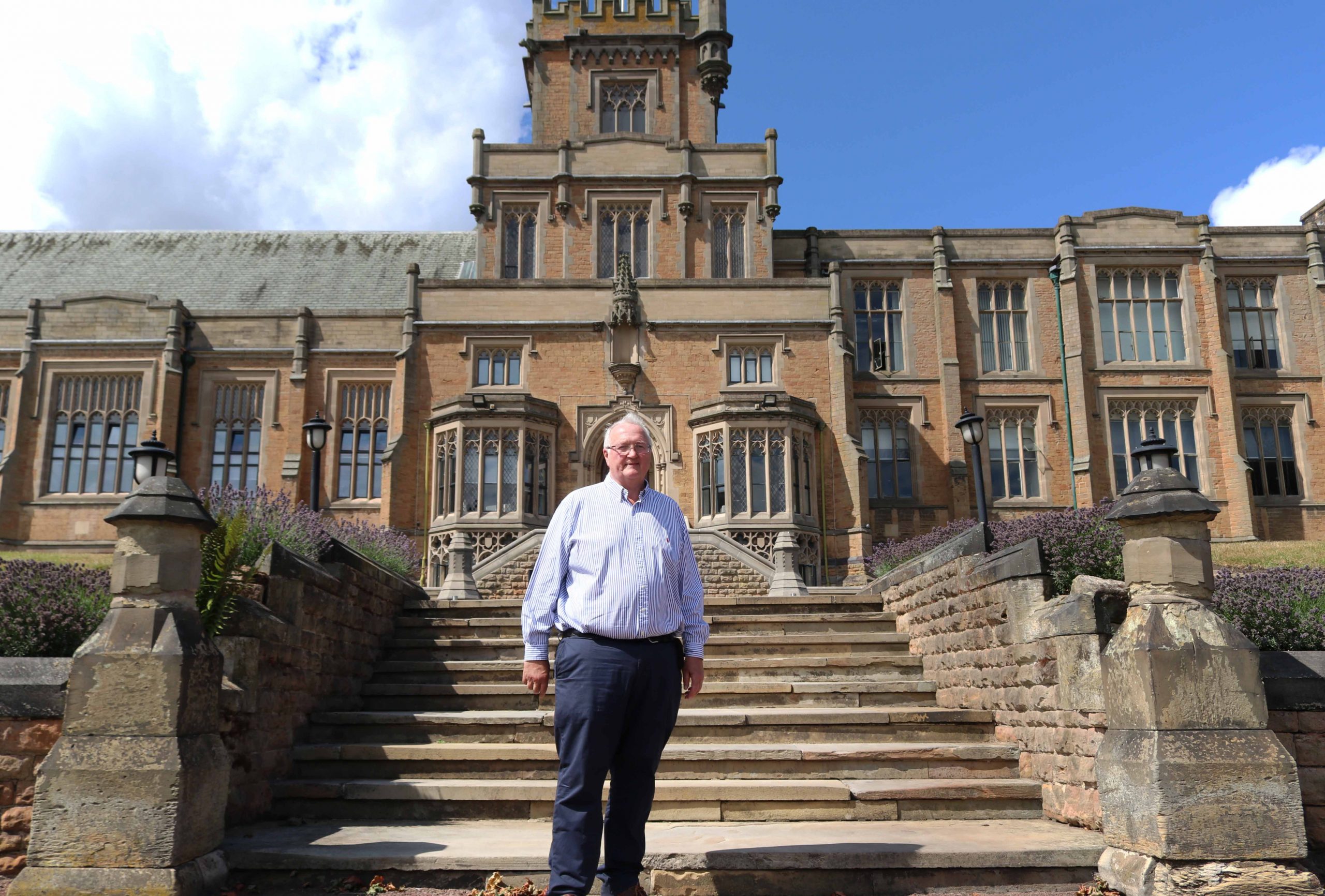 David Wild stood on the steps of the front of school